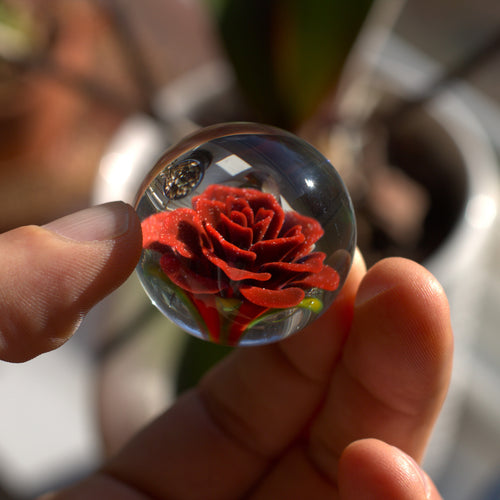 Glass marble with flower inside