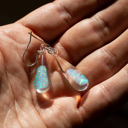 Glass earrings with triangle shaped opals encased inside